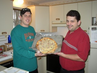 bob and mike with a meatball pizza